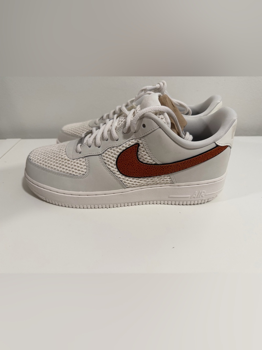 Nike Low-Top Sneaker in White with Brown Swoosh women size 13.5/ men size 12